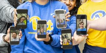 Students pose with their smartphones
