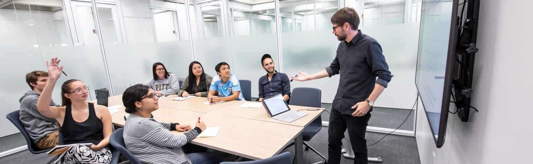 students and faculty in conference room