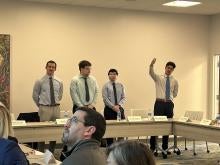 four MQE students presenting at the Pittsburgh Technology Council